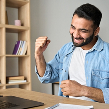 happy guy with computer