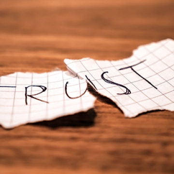 paper with trust ripped